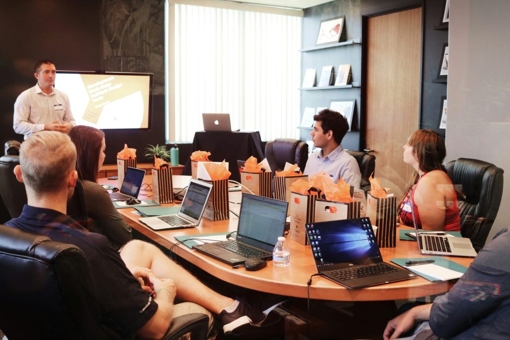 Business presentation with laptops and attentive audience